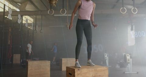 Biracial Woman Jumping on Box in Mashup of Cross Training and Digital Graphic - Download Free Stock Images Pikwizard.com