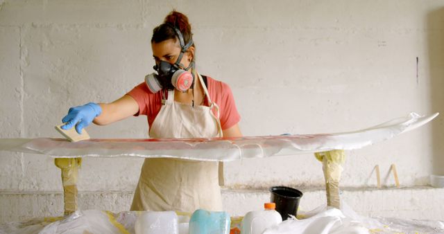 Woman Crafting Surfboard in Workshop with Safety Gear - Download Free Stock Images Pikwizard.com