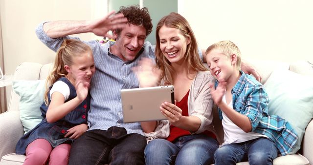 Happy Family Video Calling on Tablet Together in Living Room - Download Free Stock Images Pikwizard.com