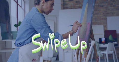 Female Artist Painting on Easel in Sunlit Industrial Studio with Swipe Up Graphic Overlay