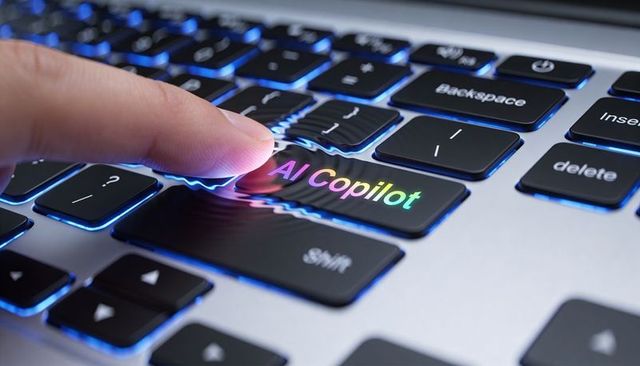 Finger pressing ai copilot key on backlit laptop keyboard with rainbow ripple effect