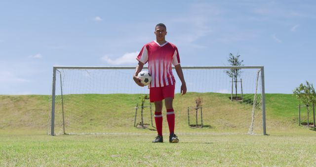 Youth Soccer Player with Ball Standing in Front of Goal on Sunny Day - Download Free Stock Images Pikwizard.com