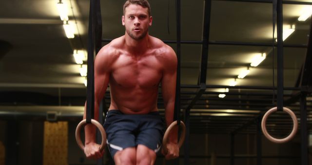 Muscular Man Gymnast Performing Ring Exercises in Gym - Download Free Stock Images Pikwizard.com