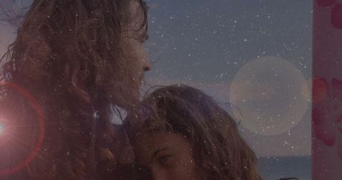 Romantic Couple Embracing on Beach at Twilight