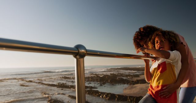 Mother and Son Enjoying Scenic Ocean View on Beach Boardwalk - Download Free Stock Images Pikwizard.com