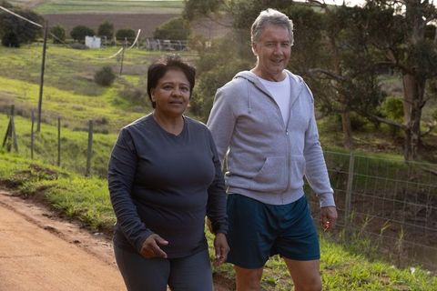 Mature Couple Enjoying Walk in Rustic Countryside Setting