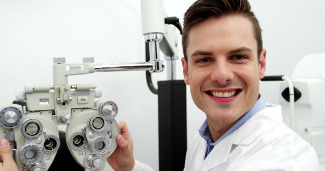 Male Optometrist Smiling While Using Retinoscope in Bright Clinic - Download Free Stock Images Pikwizard.com