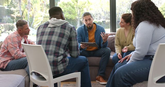 Diverse Group of Adults in Discussion During a Group Meeting - Download Free Stock Images Pikwizard.com