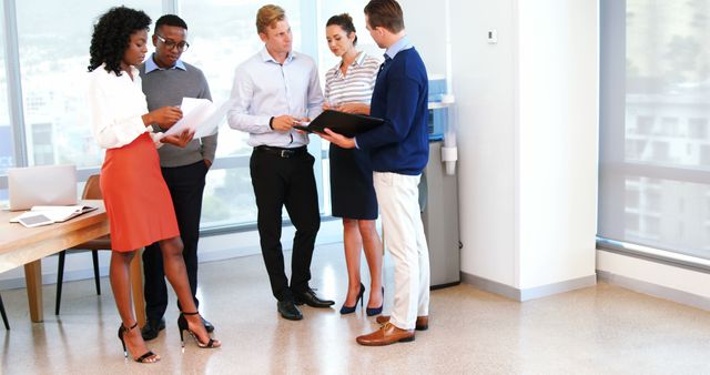 Diverse Team Having a Standing Meeting in Modern Office - Download Free Stock Images Pikwizard.com