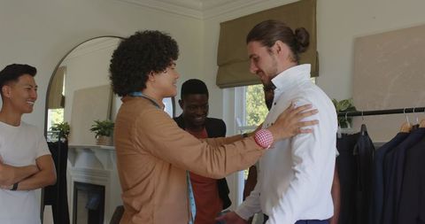 Groomsmen Assisting Groom in Suit for Wedding Ceremony Preparation