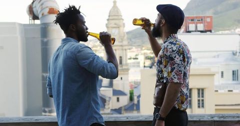 Friends enjoying rooftop gathering sharing beers