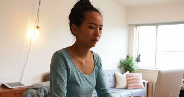 Woman Reflecting in Tranquil Home Office Setting - Download Free Stock Images Pikwizard.com