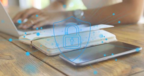 Cybersecurity Shield over Workspace with Technology Devices