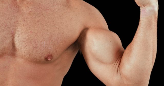 A close-up of a Caucasian man's upper body showcasing his bicep muscle, with copy space. His skin is visible with natural details such as body hair and a mole.