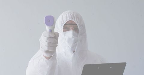 Medical Professional Conducting Temperature Check During Pandemic