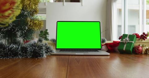 Laptop with Green Screen Amid Christmas Decorations - Download Free Stock Images Pikwizard.com