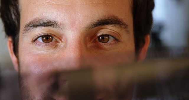 Close-Up of Man with Brown Eyes in Soft Lighting - Download Free Stock Images Pikwizard.com