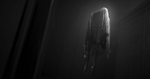 Haunting ghost floating in dark hallway