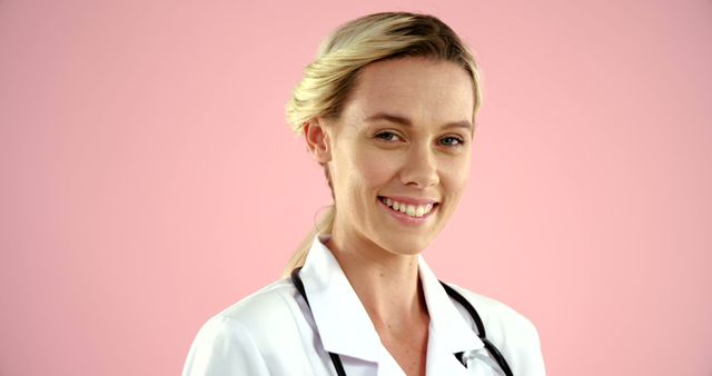 Smiling Female Doctor with Stethoscope on Pink Background - Download Free Stock Images Pikwizard.com