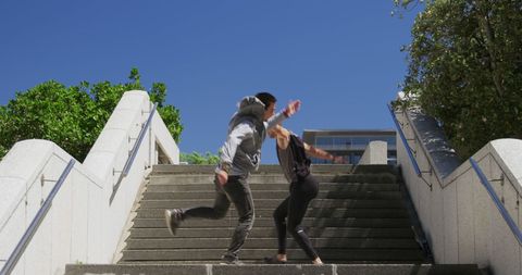Free Runners Freestyle Jump on Urban Steps on Sunny Day - Download Free Stock Images Pikwizard.com
