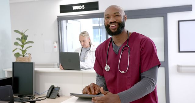 Happy Nurse Using Tablet in Busy Hospital Ward - Download Free Stock Images Pikwizard.com