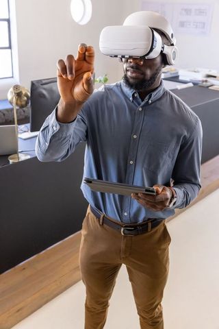 Businessman Using VR Headset with Tablet in Modern Office