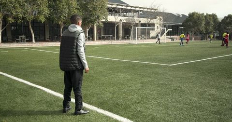 Coach Overseeing Soccer Practice on Sunny Day - Download Free Stock Images Pikwizard.com
