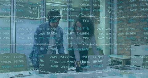 Colleagues Collaborating on Financial Solutions in Modern Office