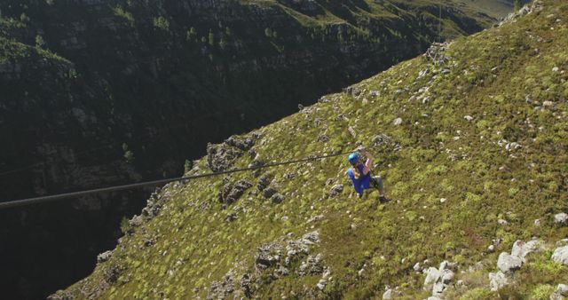 Adventurous Zip Lining Across Rocky Green Hill - Download Free Stock Images Pikwizard.com