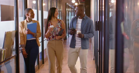 Casual Business Professionals Engaged in Office Discussion