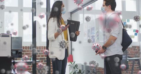 Office colleagues greeting with foot tap among pandemic