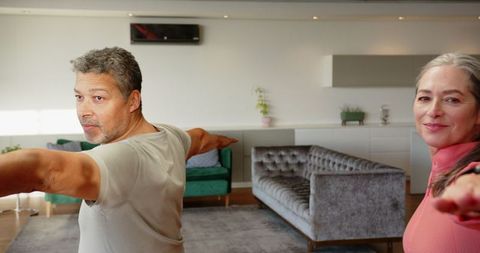 Senior Couple Engaging in Home Yoga Routine for Tranquility
