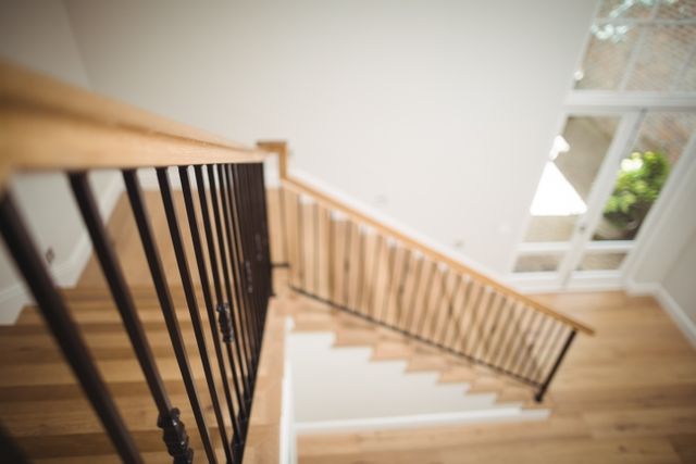 Modern Wooden Staircase with Iron Railings in Bright Interior - Download Free Stock Photos Pikwizard.com