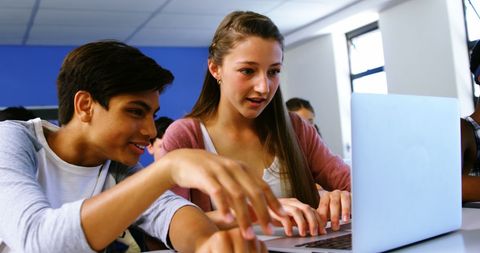 Engaged Students Collaborating on School Laptop in Classroom - Download Free Stock Images Pikwizard.com