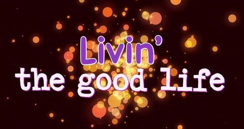 Living good life warm bokeh typography poster with amber glow and sparkling circles