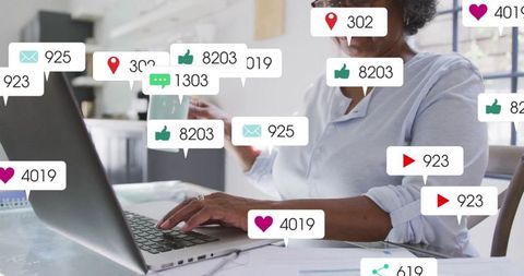 Senior Woman Engaging with Social Media Notifications in Modern Office