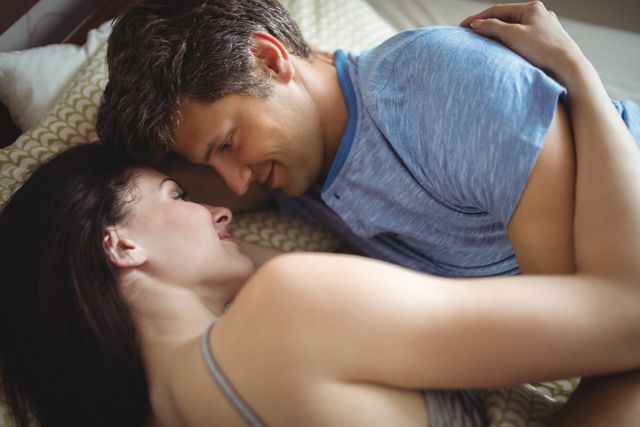 Romantic Couple Cuddling in Bed - Download Free Stock Photos Pikwizard.com