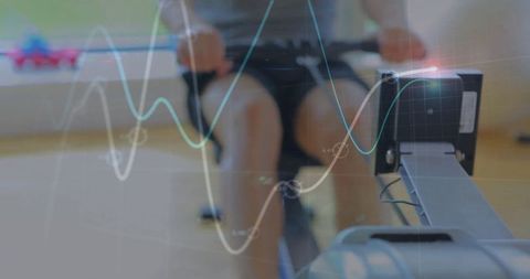 Man rowing on machine with digital fitness data overlay in gym