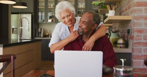 Happy Senior Couple Enjoying Time Together Online in Cozy Kitchen - Download Free Stock Images Pikwizard.com