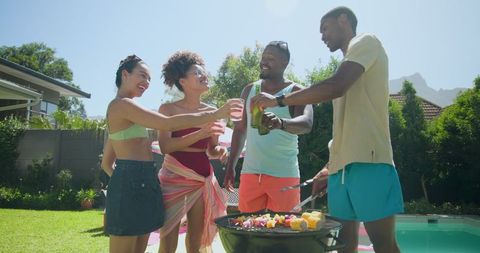 Diverse Friends Grilling by Poolside in Summer Atmosphere