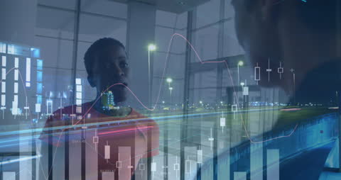 Diverse Coworkers Discussing with Financial Graphs Overlay