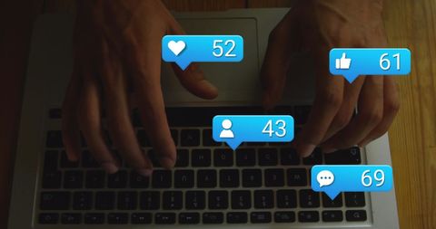 Hands typing on laptop with social media notifications overlay