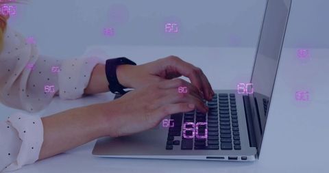 Hands typing on laptop with purple 6G data overlay conveying future connectivity