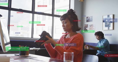 Creative Professionals Engaging with Social Media in Modern Office