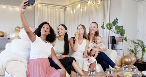Multiracial Female Friends Enjoying Birthday Party Celebration