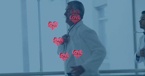 Heart Icons Overlay on Doctors Rushing in Hospital