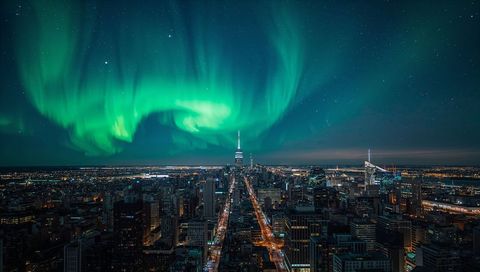 Aurora Borealis Illuminating Downtown Skyline, Tower Spire and Long Avenue at Night