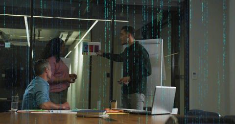 Creative team presenting color palette in glass conference room during design review