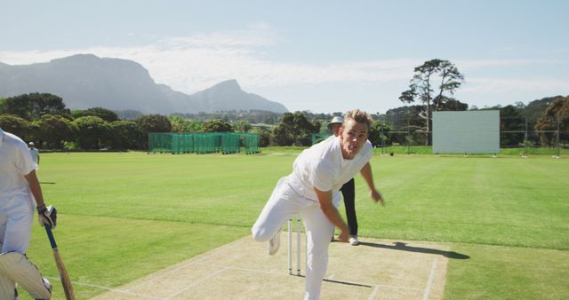 Bowler in Action during Cricket Match on Sunny Day in Field - Download Free Stock Images Pikwizard.com