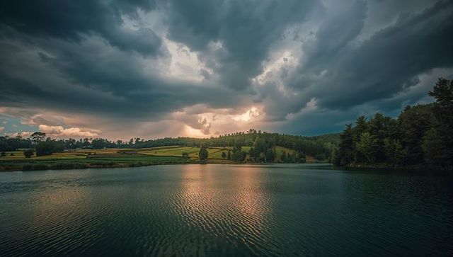 Serene Lake Amid Storm Clouds and Lush Rural Landscape